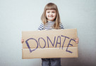 image of a child with a donation box