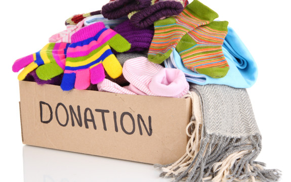 donation box full of fall and winter clothes