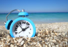 Clock on beach